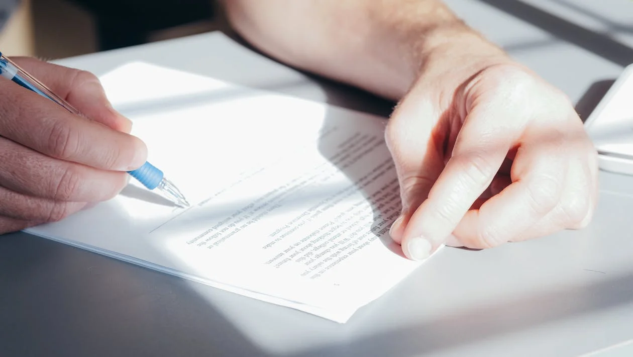 Person signing conditional approval agreement documents